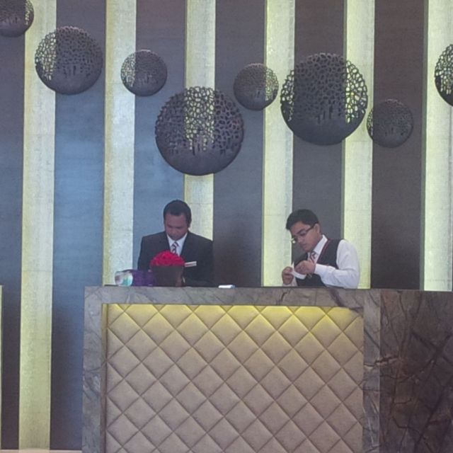 The staff at hotel helps me prep a gift for my buddy Mohan. They went and found tape, a box, wrapping paper, then did a wrap-job that would make Santa Claus weep.