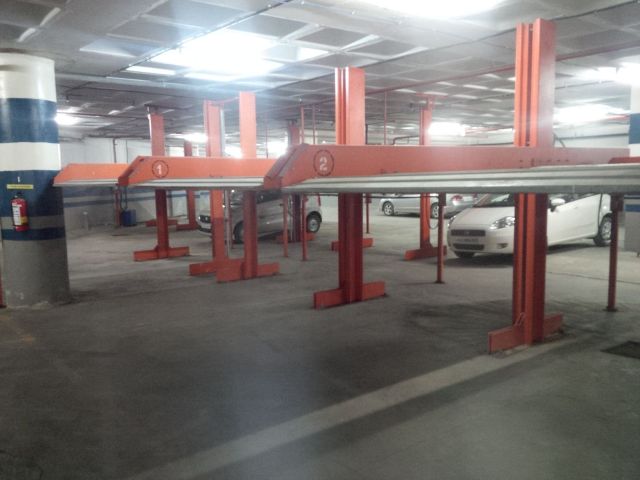 This is a parking garage with lifts.  I am thinking this won't catch on in Vermont, since nobody's 4WD is fitting under one of those.