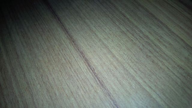 Really close up picture of the nightstand at the hotel, about 3am IST.