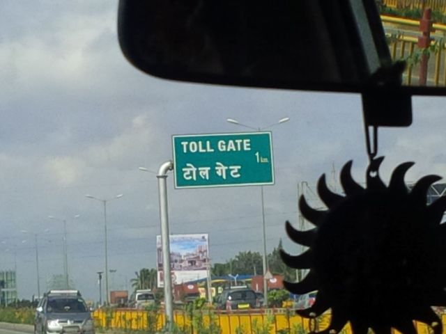 I saw this sign, and braced myself to learn how to say "Toll Gate" in Hindi.  It's... "toll gate".  So... with the words for "car" and "truck" sounding near exactly like "car" and "truck", it seems I can navigate the basics of driving and ordering my favorite drink while on the road.