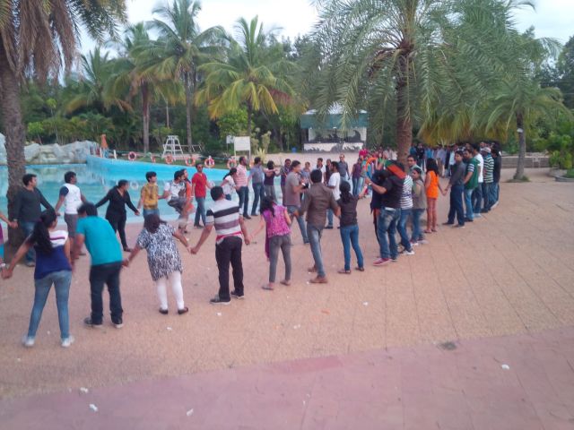 Team Building Event: pass a hula hoop down the line, without letting go of your neighbor's hands.  This took a while, and  in my humble opinion the mere physics involved undermine the intent.  The best part was when the MC got upset that the teams disassembled his hula hoop.  I laughed :-)