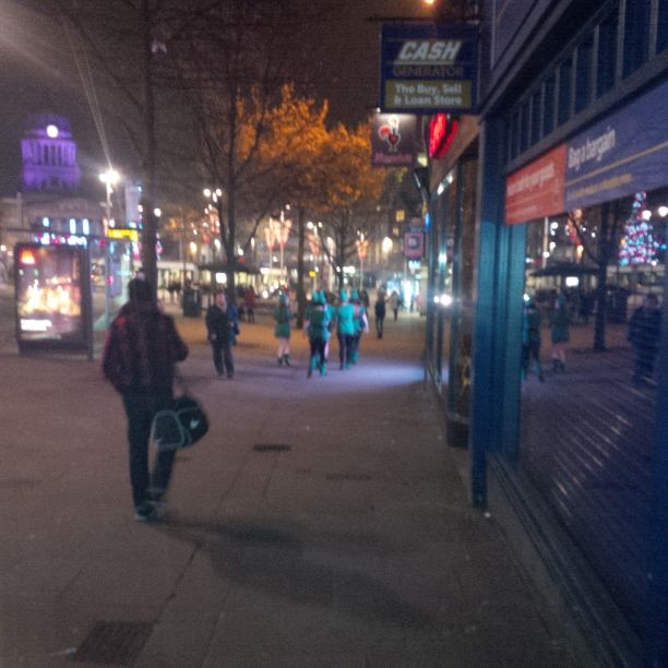 Nottingham at night. The blurry green folks are dressed up as Robin Hood.