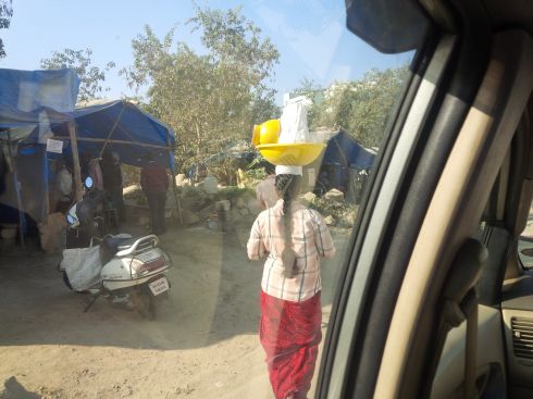 First time I've seen someone purposely carrying a basket on head.