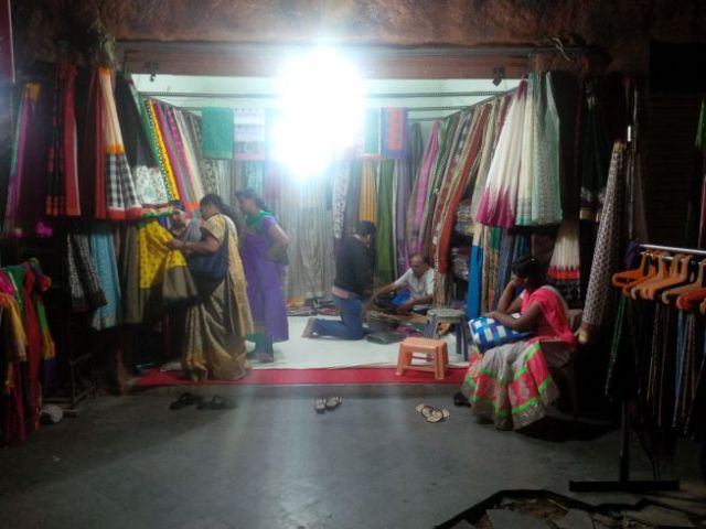 Mohan haggles some fabric.