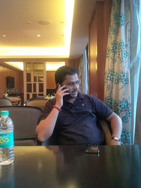 With Mohan, the ever busy and troublesome guy.